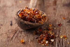 gum arabic, also known as acacia gum in old wooden spoon